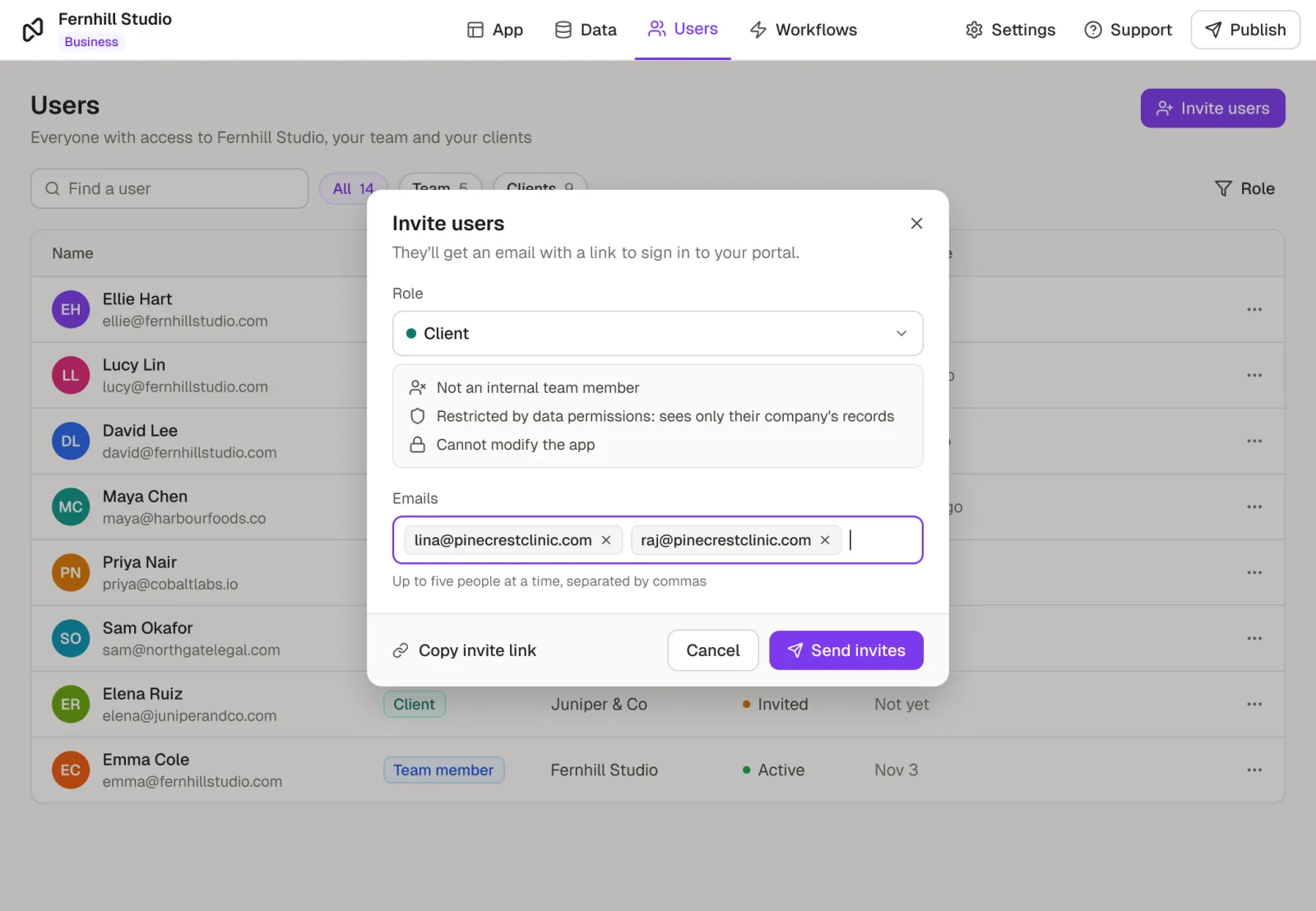 Inviting two people from a new client to a Noloco portal with the Client role: not a team member, restricted by data permissions, unable to modify the app